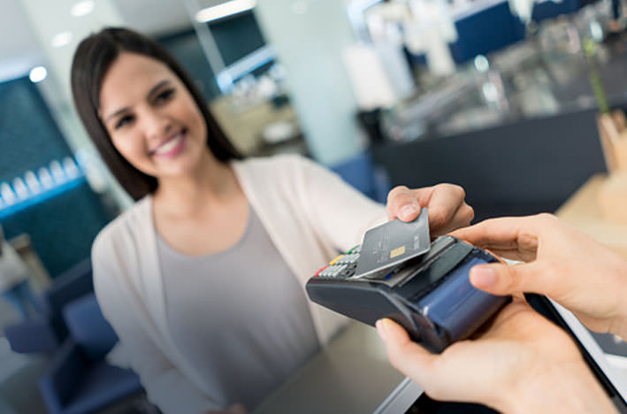 Lady scanning credit card 