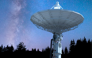 Space technology demonstrated through a large ground station pointed at the night sky